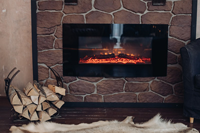 Stock photo rustic electric fireplace - Dunrite Chimney Centereach NY Rustic Electric Fireplace with basket of wood and fur rug - Dunrite Chimney
